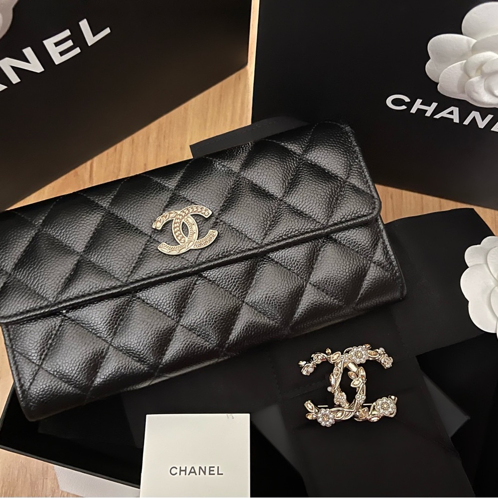 CHANEL Black Quilted Clutch with Gold Logo